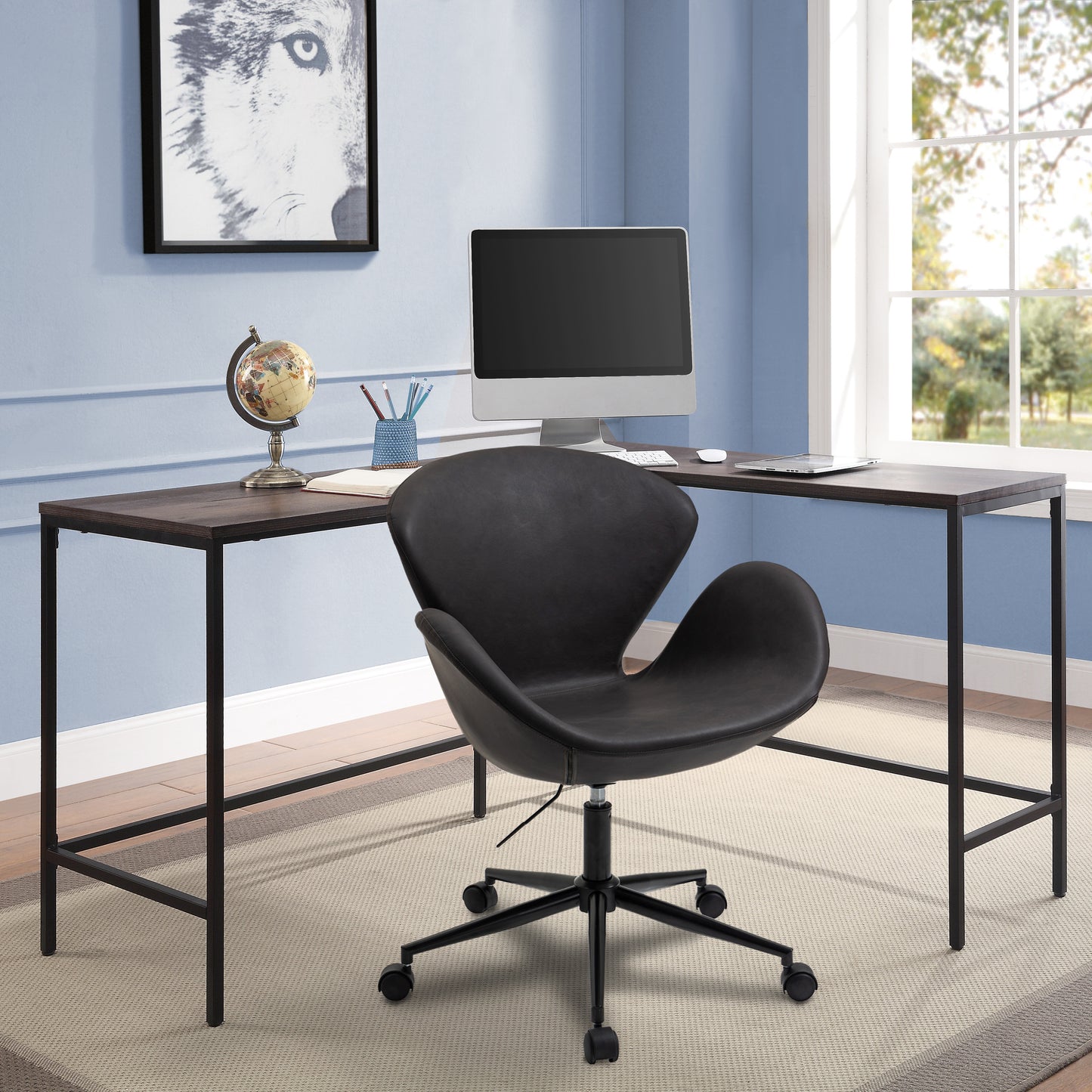 Black U shaped office chair in office in front of L shaped desk