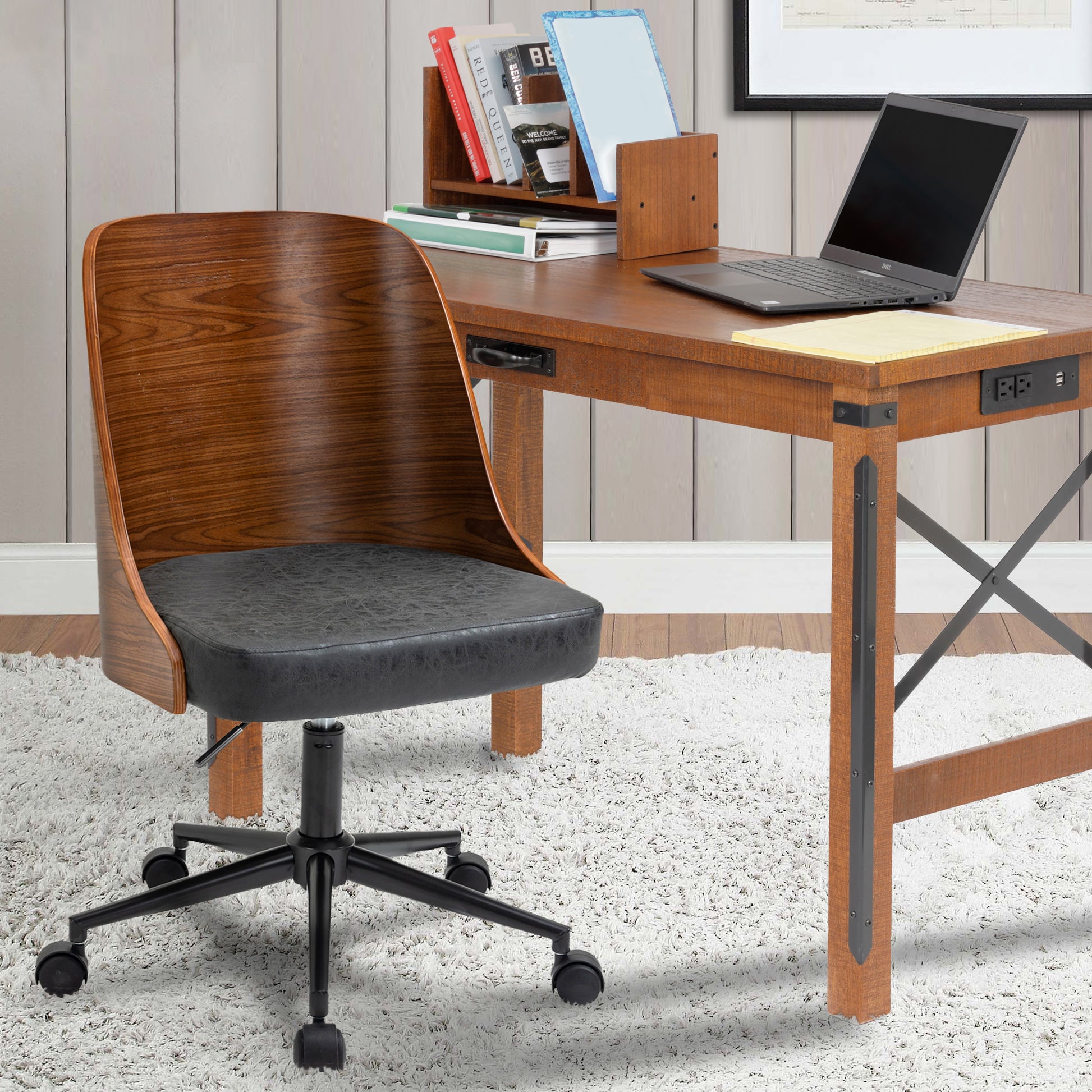 Wood and black office chair next to desk in room with white rug