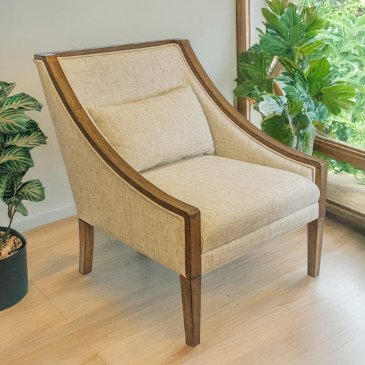 Beige armchair with wooden frame in a room with plants