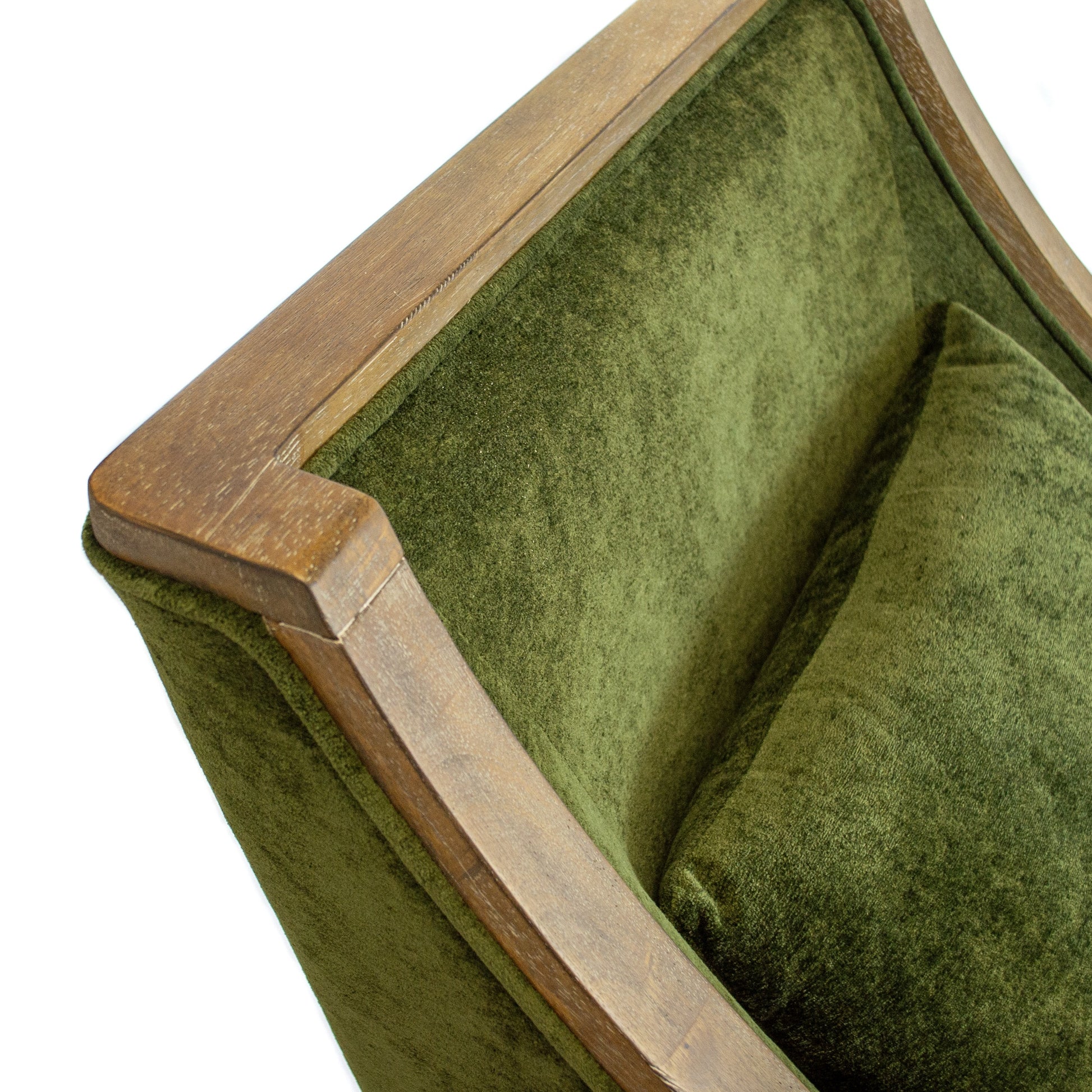 closeup of top features of green armchair